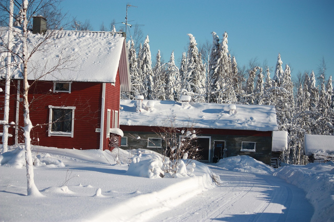 Wooden cabin standing alone in a snow-covered landscape in northern Finland
