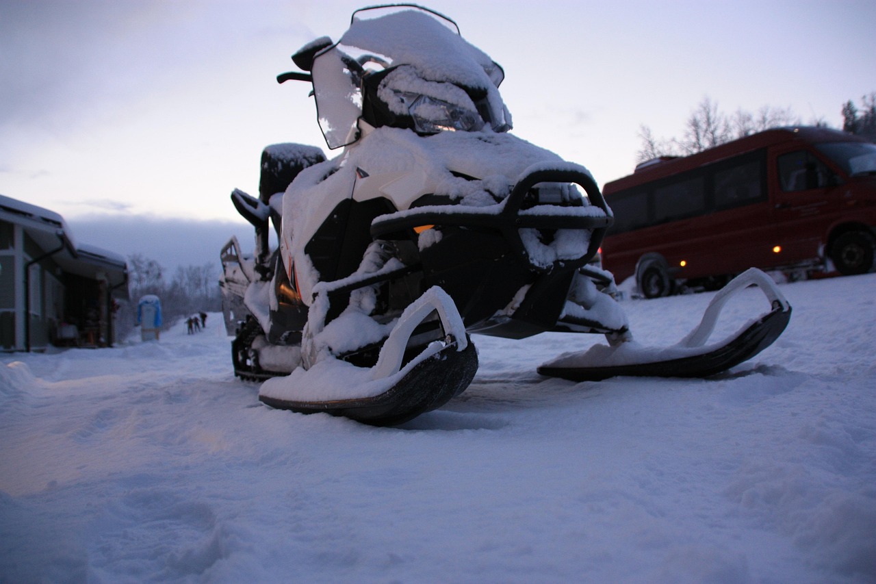 Snowmobile parked on a snowy plateau in Lapland